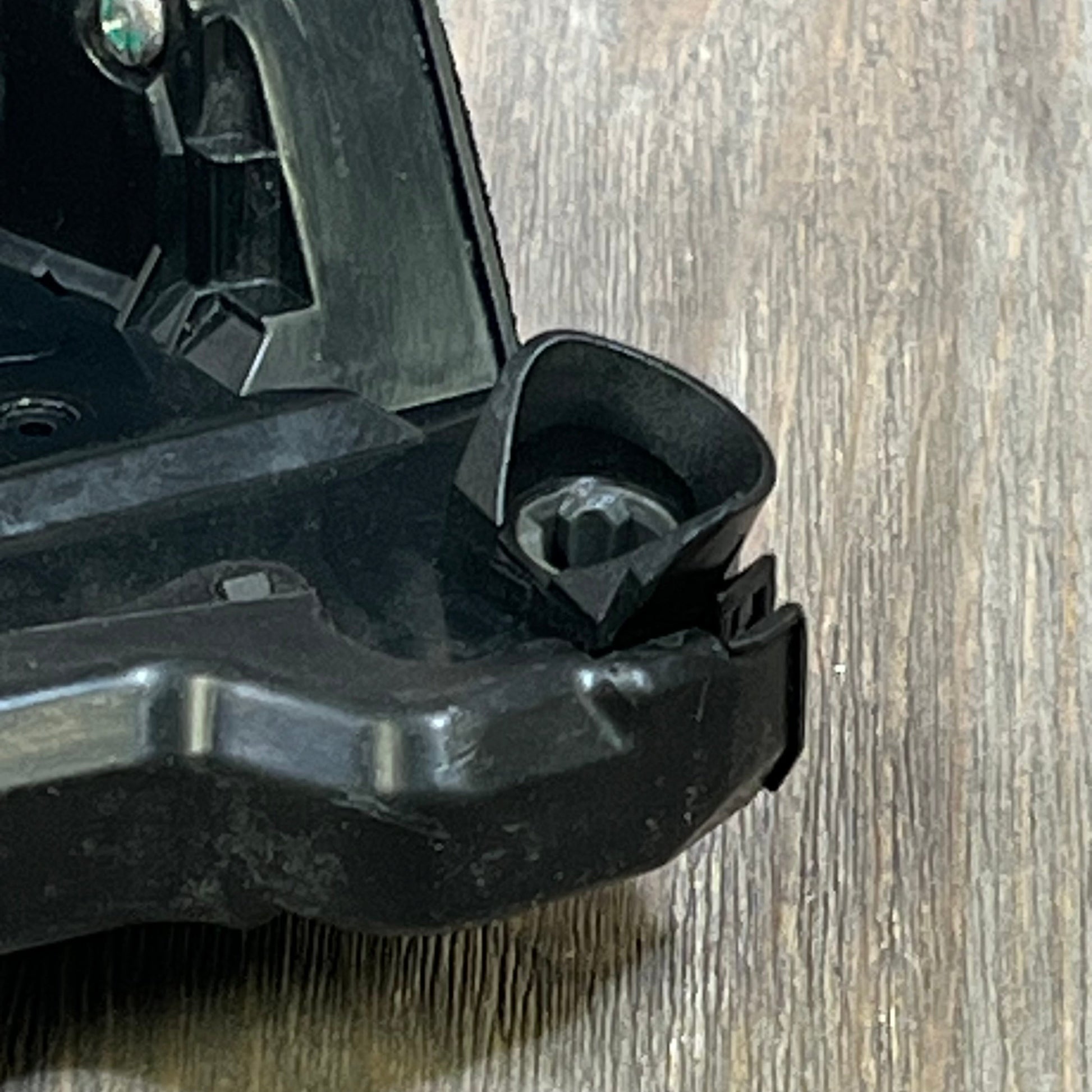 Close-up of SYERAL power door lock actuator showing detailed latch mechanism for Toyota, Lexus, and Scion models.