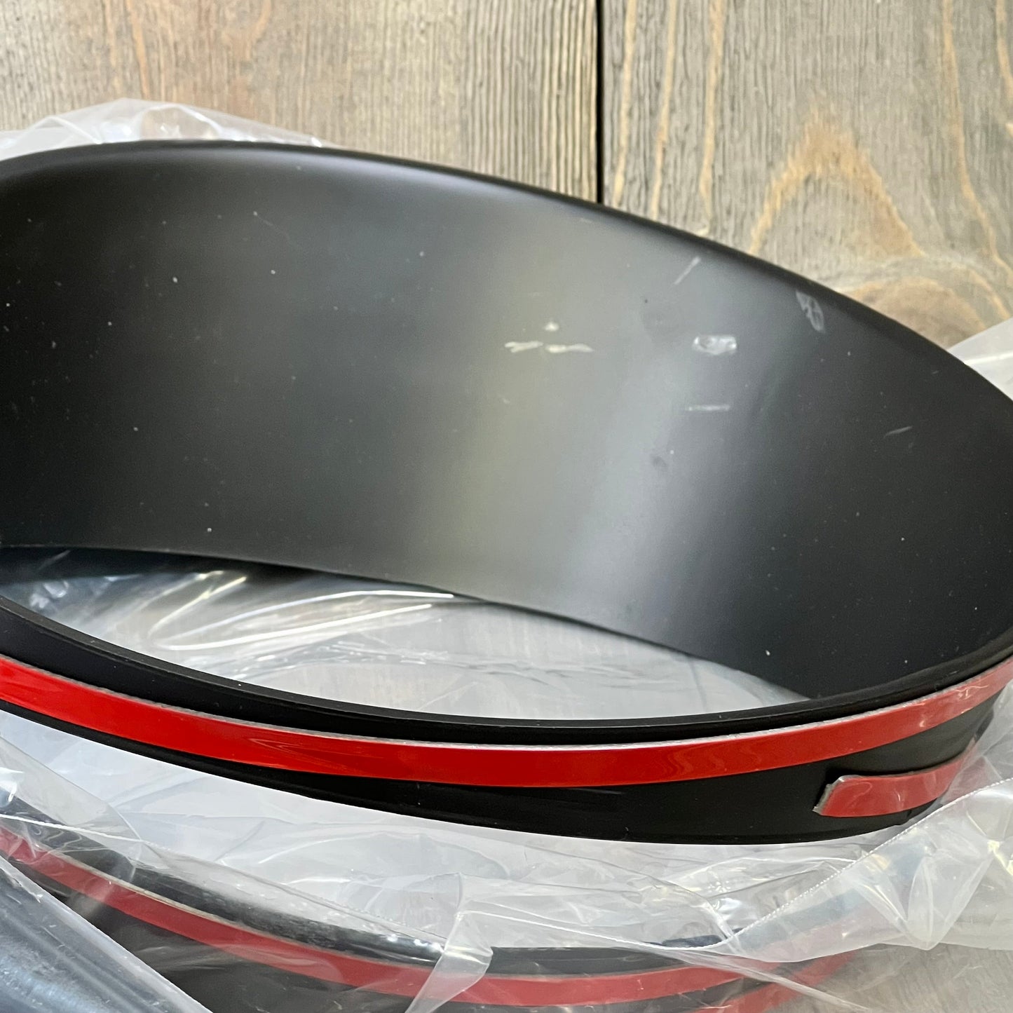 Matte black headlight trim cover for Jeep Wrangler JL 2018-2023, showcasing sleek design and durable finish.
