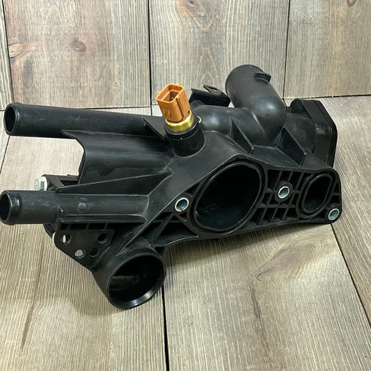Engine coolant thermostat housing replacement for Kia Forte 2010-2013, durable black assembly with multiple ports.