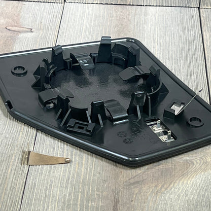 Passenger side heated mirror backing for Dorman 56316, featuring durable black plastic and heating elements.