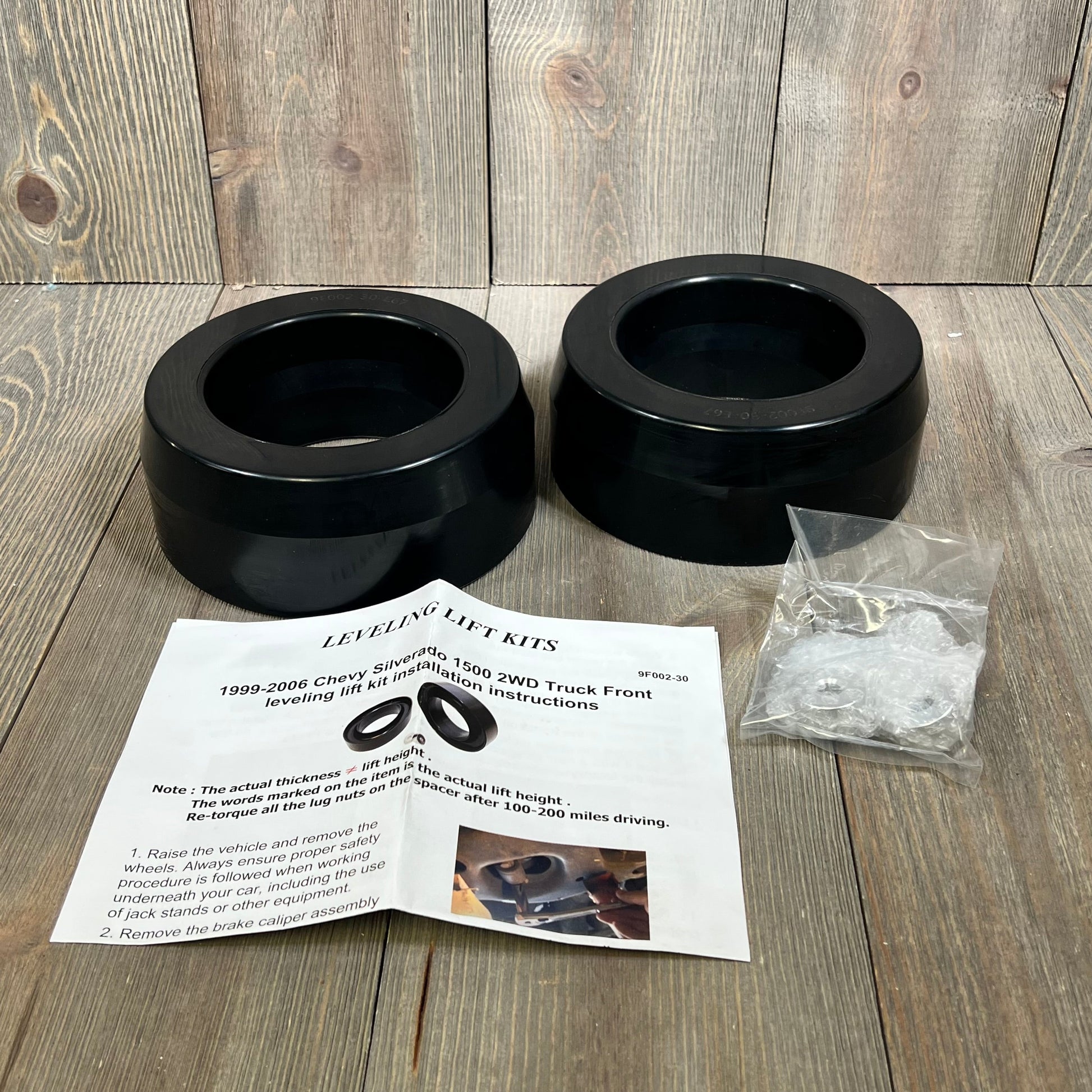 Dynofit 3" front coil spring strut spacer kit with installation guide for 1999-2006 Chevy Silverado 1500 2WD.