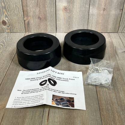 Dynofit 3" front coil spring strut spacer kit with installation guide for 1999-2006 Chevy Silverado 1500 2WD.