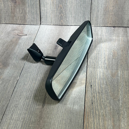 OEM KD53-69-220B interior rearview mirror for Mazda 3, CX-3, CX-5, MX-5, shown on a wooden surface.