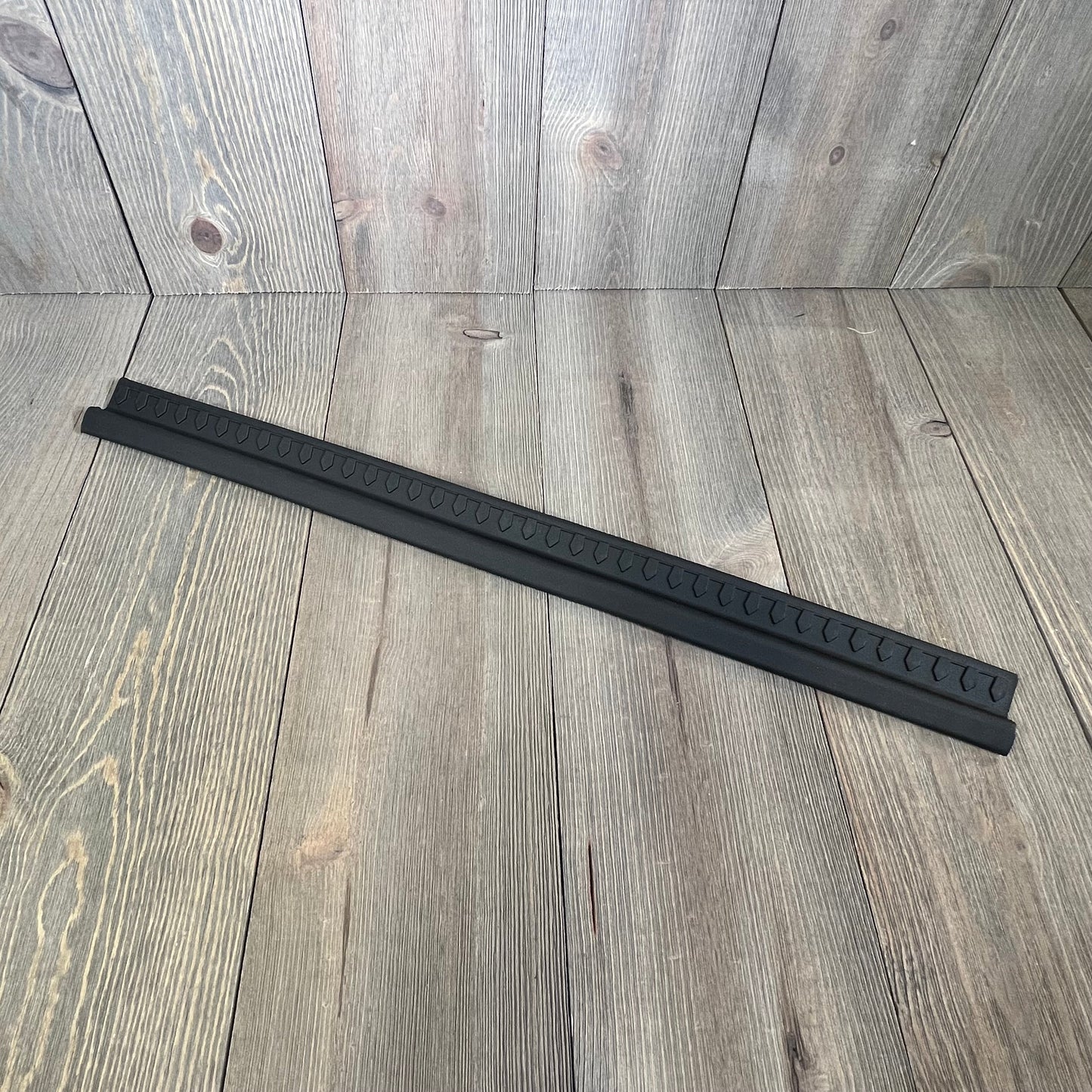 Black thermoplastic entry guard for Jeep Wrangler TJ/LJ 1997-2006, 2-piece set, durable and easy to install.
