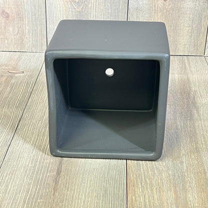 Modern black ceramic square plant pot on wooden floor, ideal for small succulents, part of a decorative set of 2 planters.