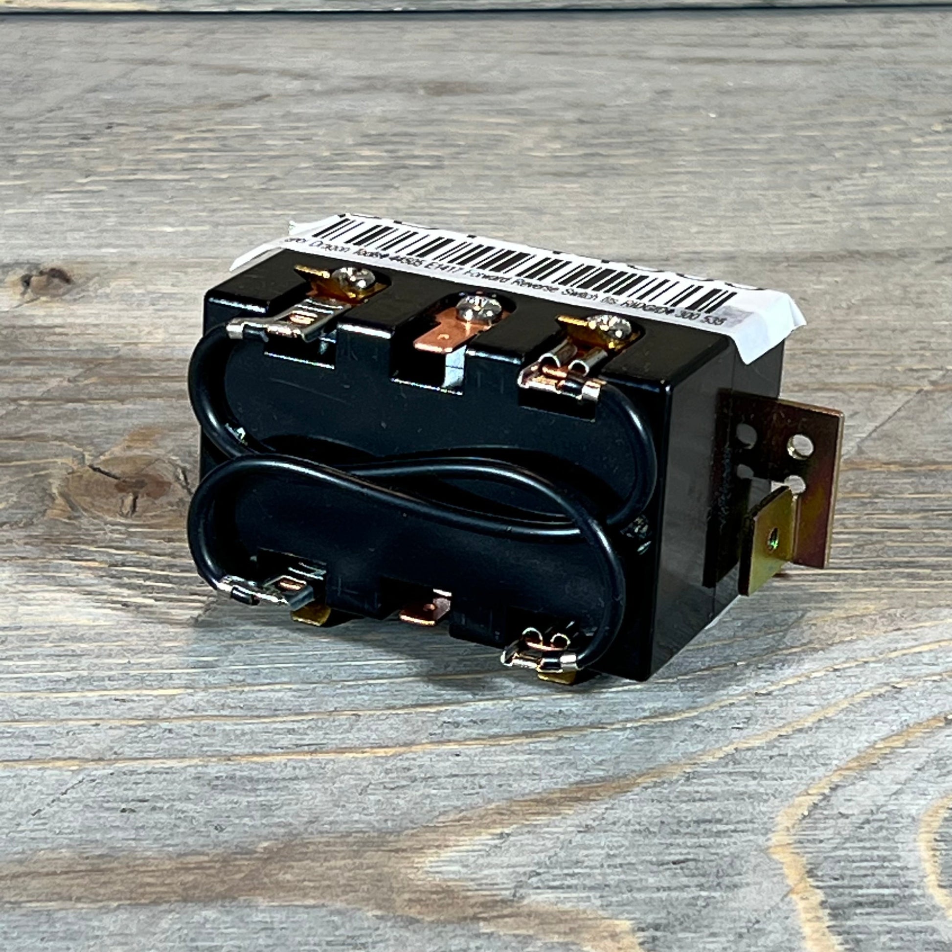 Black Steel Dragon Tools switch compatible with Ridgid 300 and 535, featuring robust connectors on wooden surface.