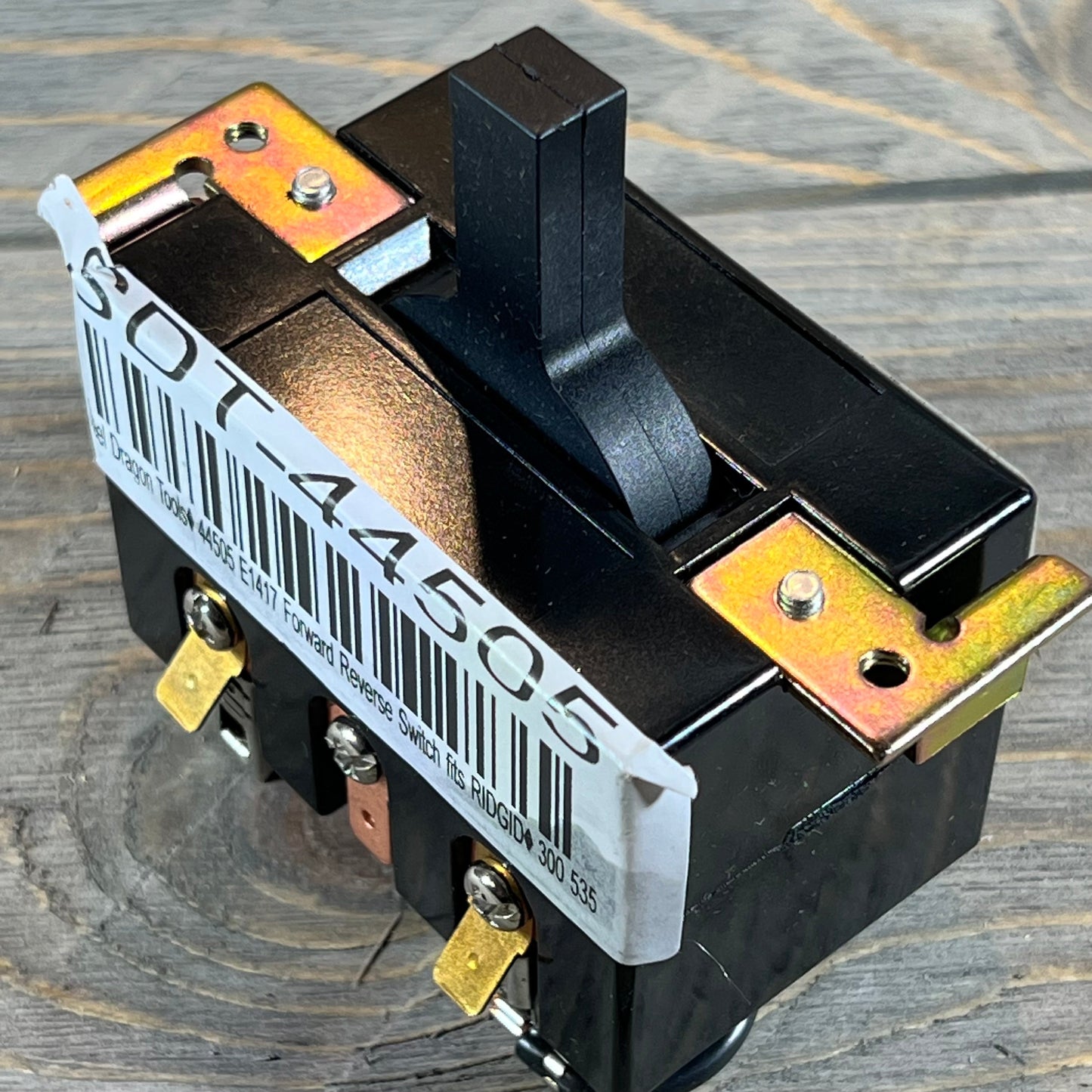 Black Steel Dragon Tools switch for Ridgid 300 and 535, shown with metal connectors and barcode on a wooden background.