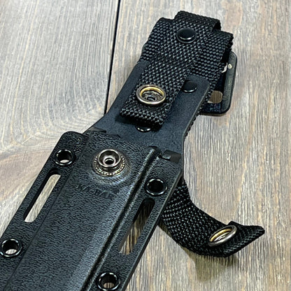 Black Ka-Bar Kydex sheath for short knives, featuring durable snap fasteners, designed for secure outdoor carry.