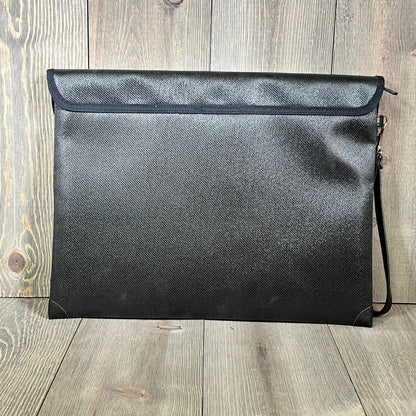 Fireproof document bag with lock, 9-layer heat insulation, black design, on a wooden surface.