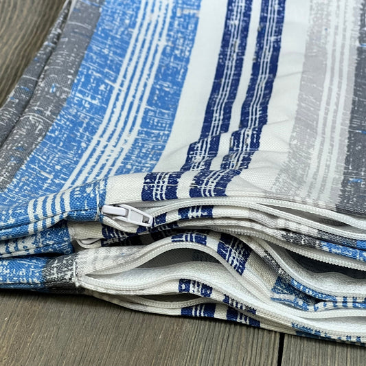 Stripe layered blue lumbar pillow covers with zippers, perfect for outdoor patio furniture. Durable and stylish cushion cases.