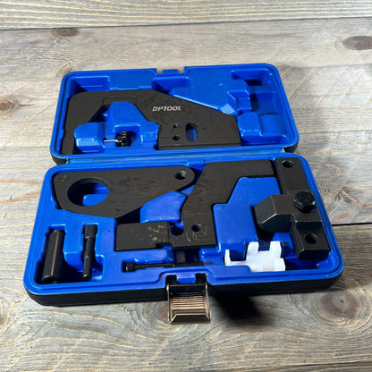 Blue case with DPTOOL camshaft timing lock tool set for Ford/Jaguar engines on wooden background.