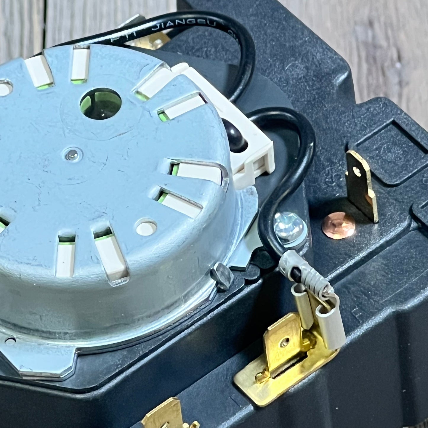 OEM Dryer Timer Replacement model WE04X25280, showcasing durable metal components and wiring for GE dryers.