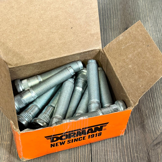Box of Dorman 610-383 wheel studs for Dodge, featuring serrated design and 9/16-18 threading, 10-pack set.
