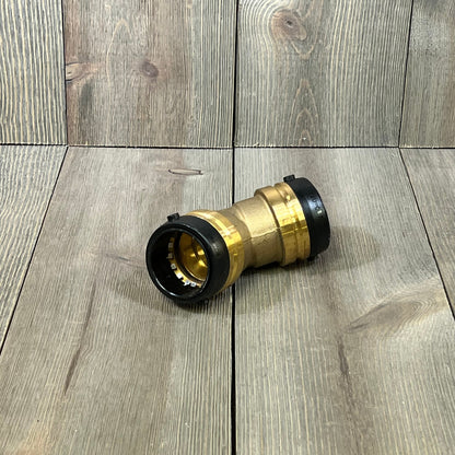 SharkBite 1-1/2 inch 45-degree elbow push-to-connect brass fitting on wooden surface, ideal for PEX, copper, CPVC pipes.