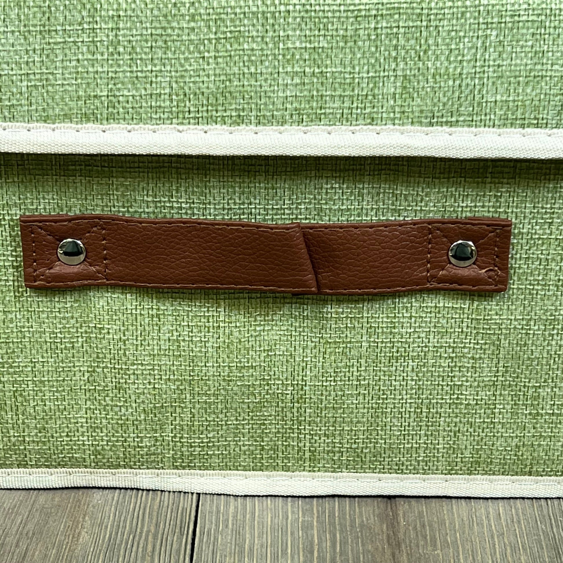 Green cotton linen storage box with faux leather handle, perfect for organizing closets and shelves, small size.