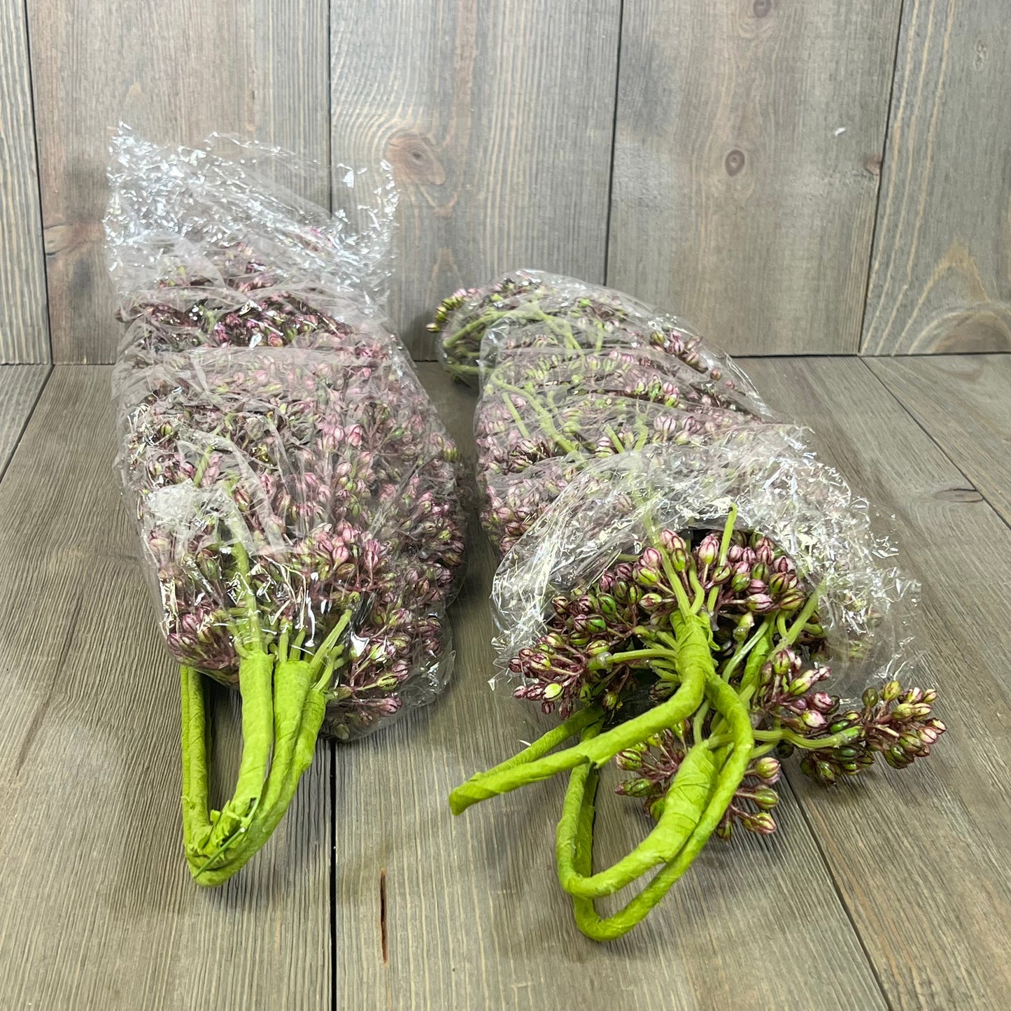 Faux plum sedum berry stems wrapped in plastic, ideal for autumn home decor and DIY crafts.
