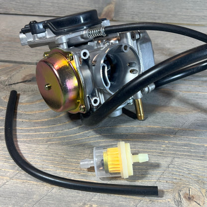 Carburetor and fuel filter for Suzuki Eiger 400 LTF400 Manual 2002-2007 on wooden surface.