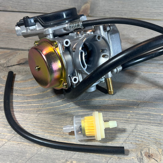 Carburetor and fuel filter for Suzuki Eiger 400 LTF400 Manual 2002-2007 on wooden surface.