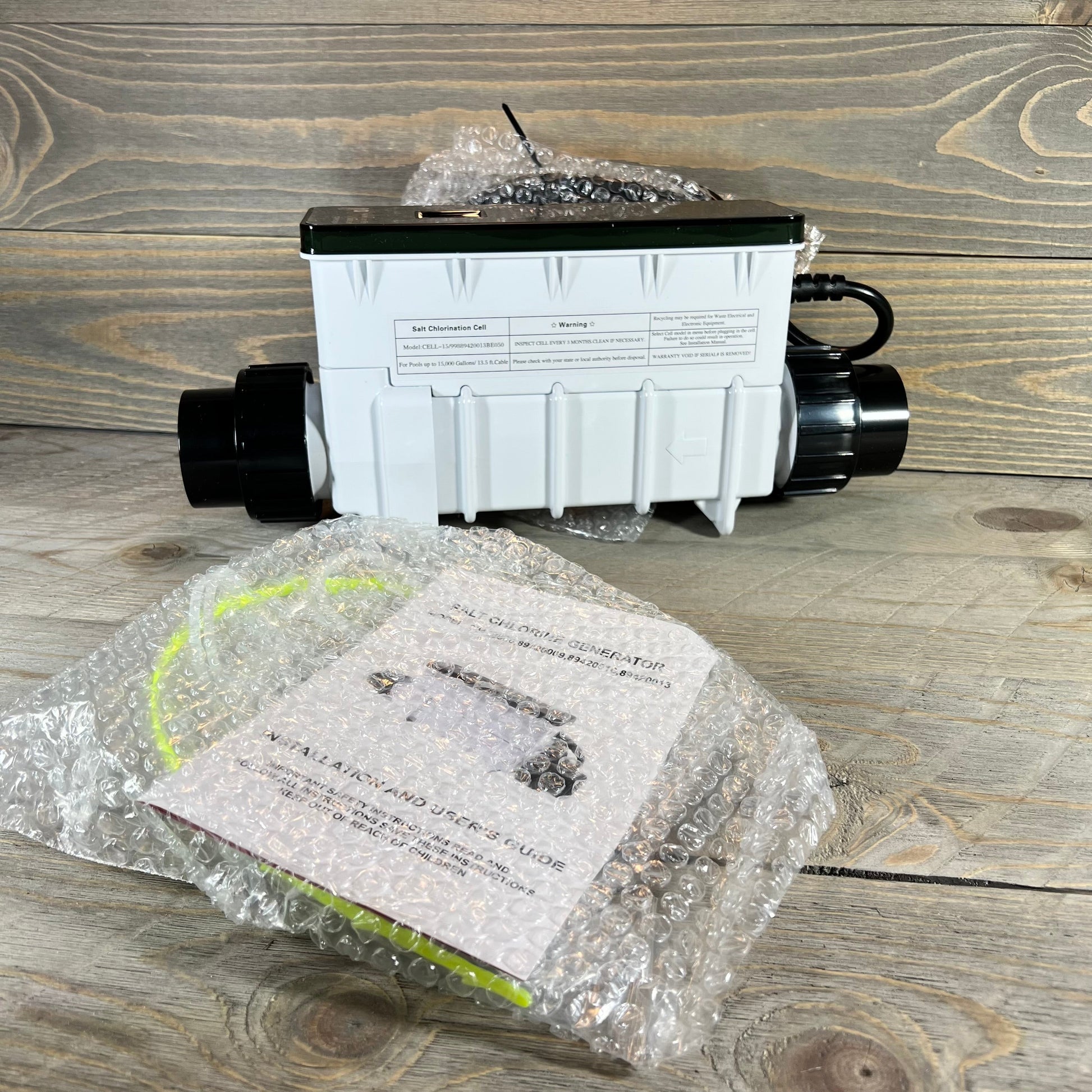 Chlorine generator replacement part for Pentair Intellichlor IC 15, shown with user guide and packaging.