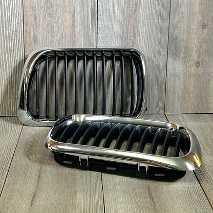 Black chrome kidney grille for '97-'99 BMW 3 Series E36, enhancing front hood with sleek, modern design.