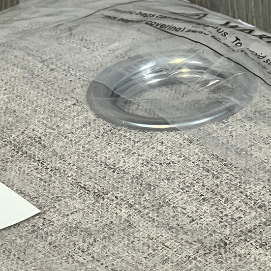 Joydeco blackout curtain detail showcasing the textured linen fabric and metal ring for easy sliding on patio doors.
