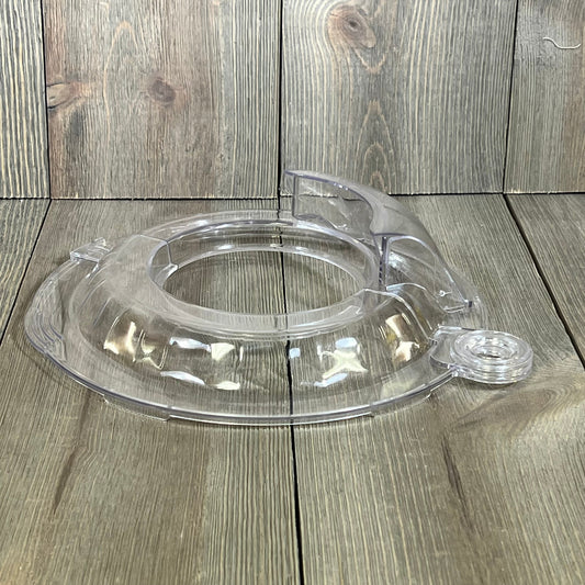 Pouring shield for KitchenAid Tilt Head 4.5-5QT mixer, clear splatter guard accessory on wood background.
