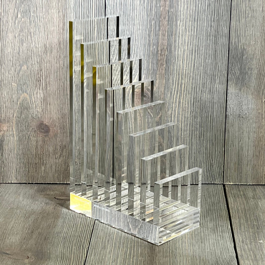 Clear acrylic collator and bookend by Russell+Hazel, perfect for organizing books, size 5” x 8” x 2.5”, modern design.