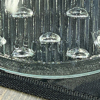 Clear tempered lens for Hayward underwater lights, model SPX0540Z1, showcasing intricate texture and design.
