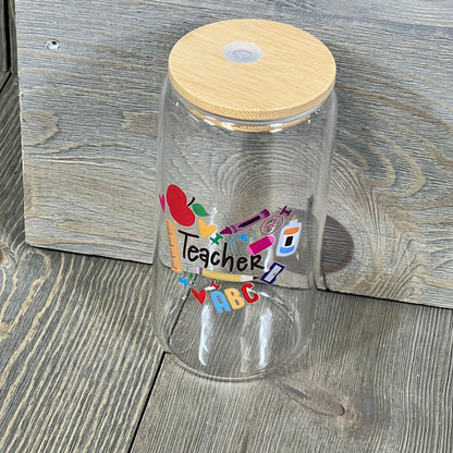 Teacher appreciation glass cup with colorful design, bamboo lid, and straw. Perfect 16 oz gift for Teachers Week.