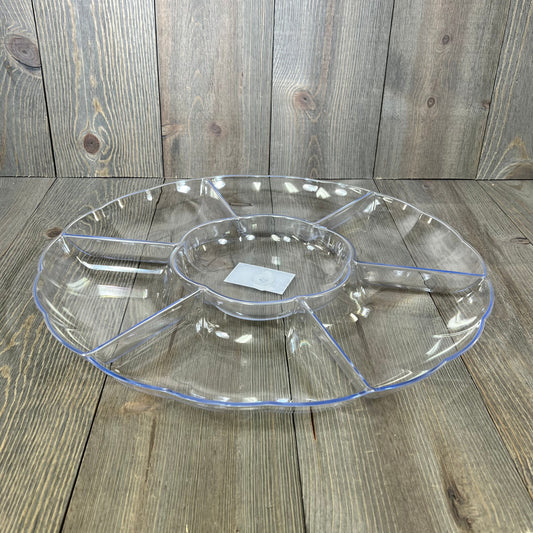 Clear 16-inch round serving tray with 7 sections, perfect for parties. Durable hard plastic, ideal for appetizers or snacks.