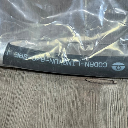 Premium A/C discharge line hose assembly for Jeep Wrangler 2007-2011, shown in protective packaging.