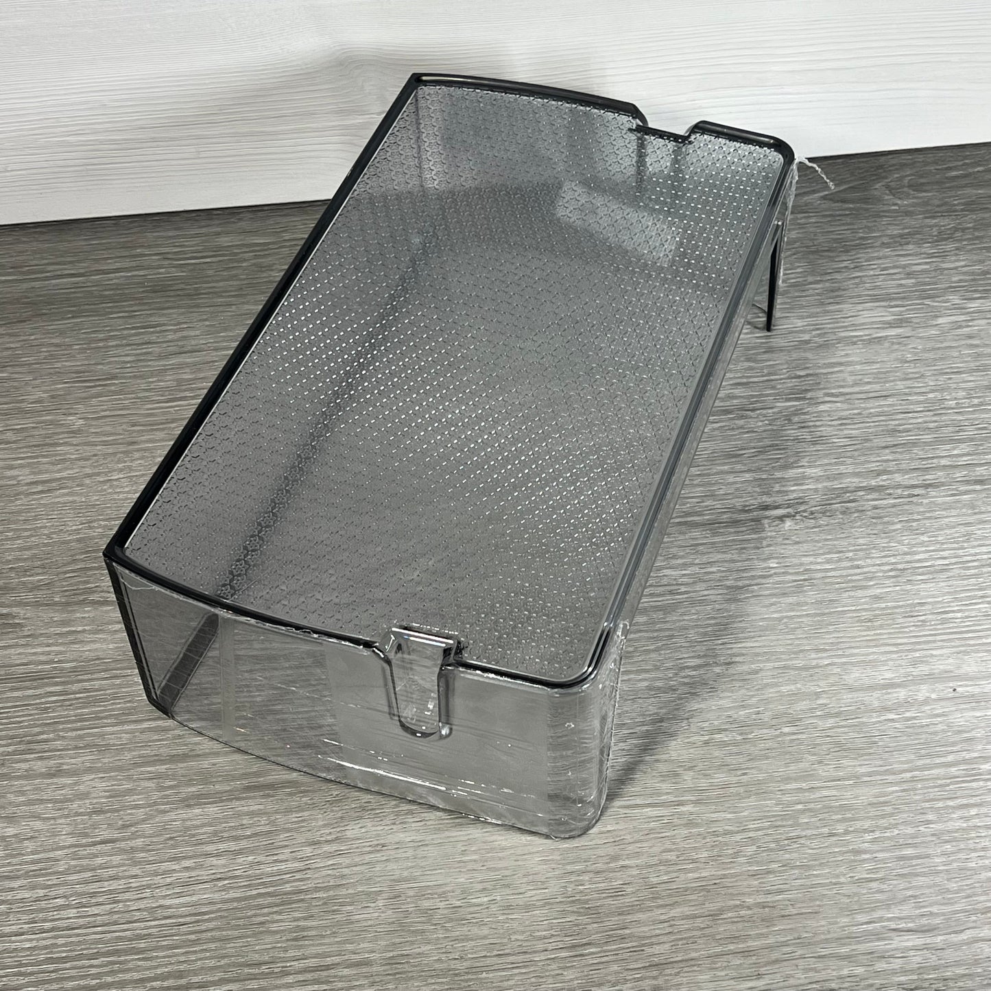 Clear replacement shelf bin for Samsung refrigerators, model DA97-21912A, shown on a wooden surface.