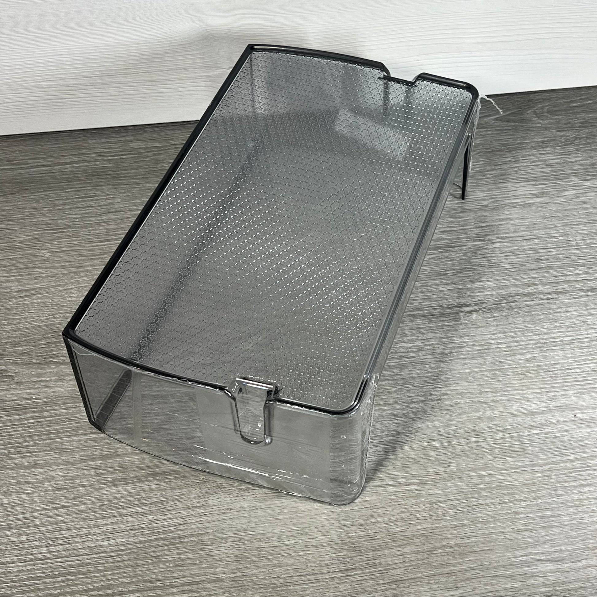 Clear replacement shelf bin for Samsung refrigerators, model DA97-21912A, shown on a wooden surface.