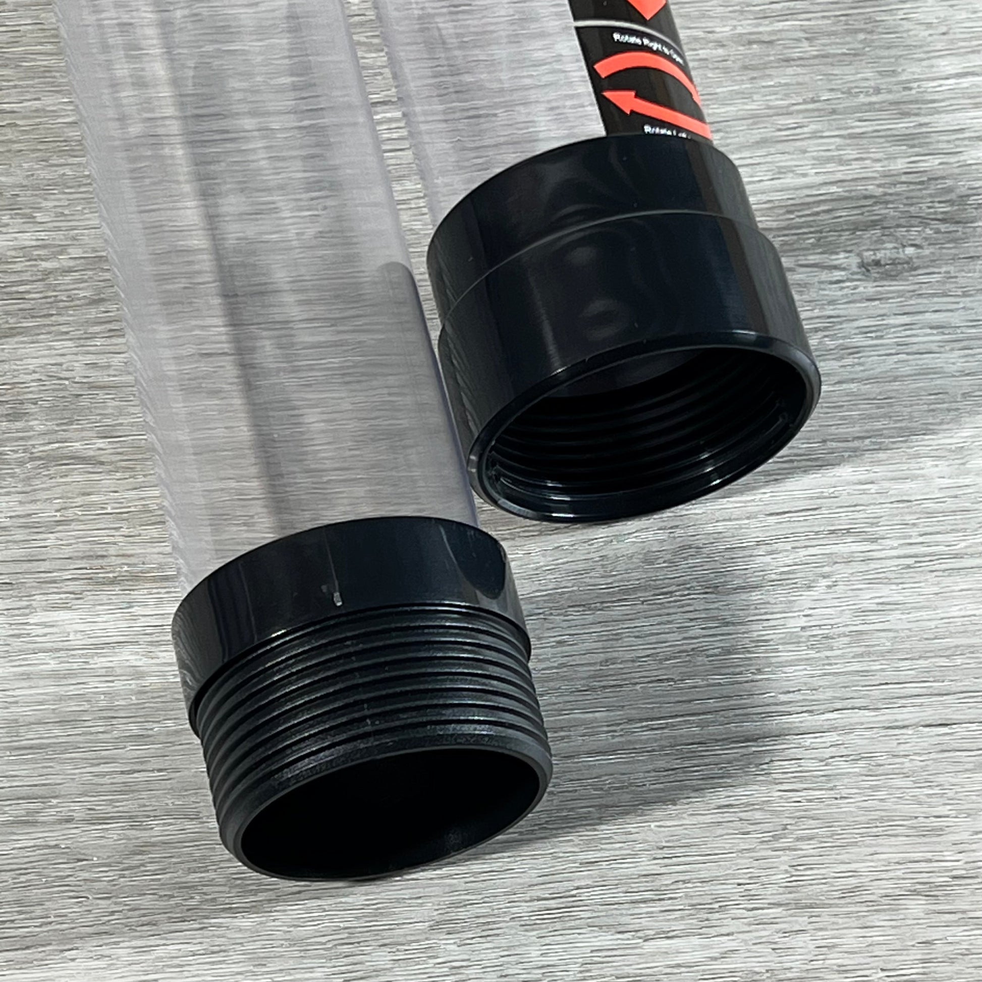 Close-up of 36-inch plastic tube ends for golf ball retriever tool, highlighting durable construction and threading.