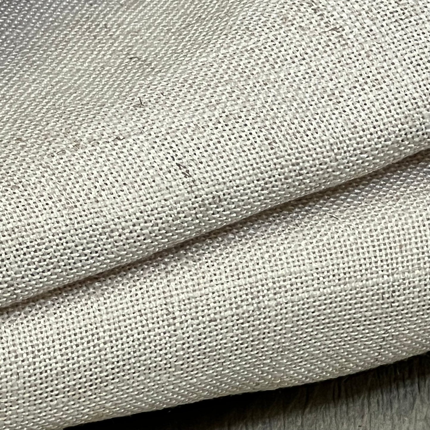 Close-up of H.VERSAILTEX linen fabric showcasing texture and weave, ideal for semi-sheer light-filtering curtains.