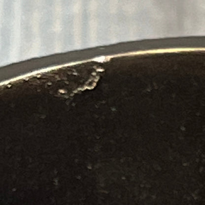 Close-up of a burgundy tumbler edge with slight imperfections, part of the Popular Bath Ombre Rose Design collection.