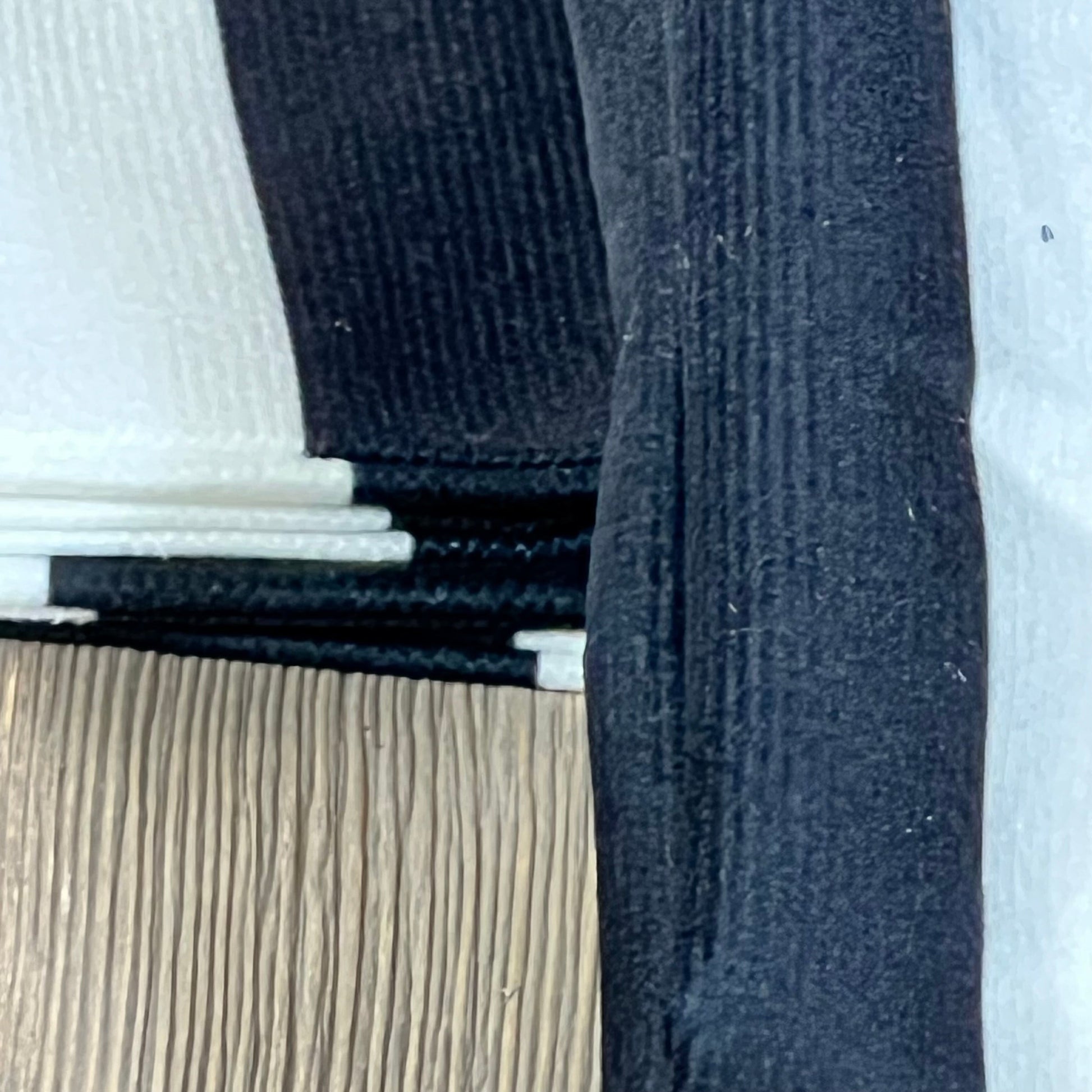 Close-up of Leaveland white and black stripe cushion slipcover, showcasing durable cotton polyester texture and stitching.