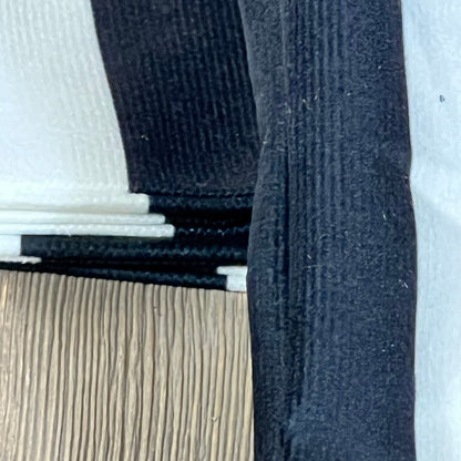 Close-up of Leaveland white and black stripe cushion slipcover, showcasing durable cotton polyester texture and stitching.