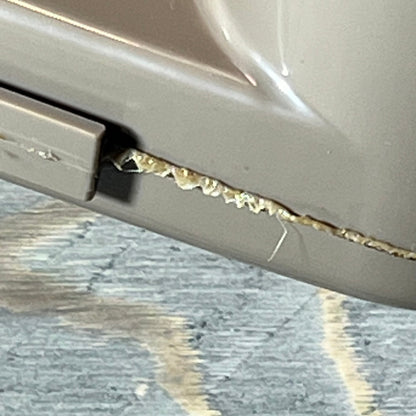 Close-up of a damaged edge on the top manifold replacement for Hayward Swim Clear cartridge filter.