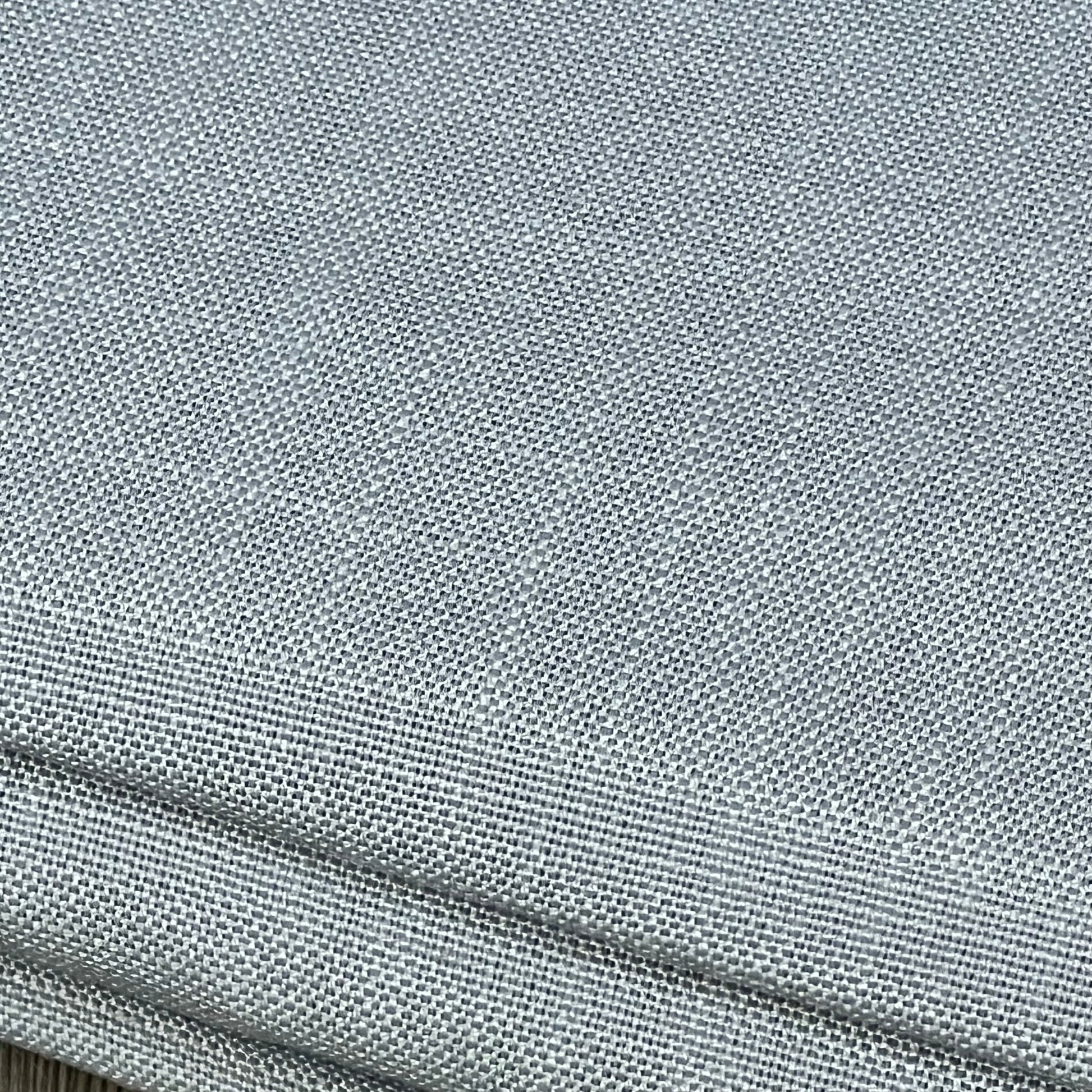 Linen-textured grey tablecloth, wrinkle-free and spill-proof, showcasing premium fabric quality for dining elegance.