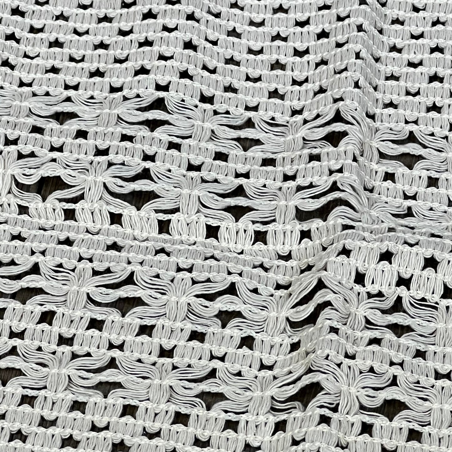 Cream beige macrame table mat showcasing intricate weave, ideal for farmhouse dining decor. Heatproof, cotton linen placemat.