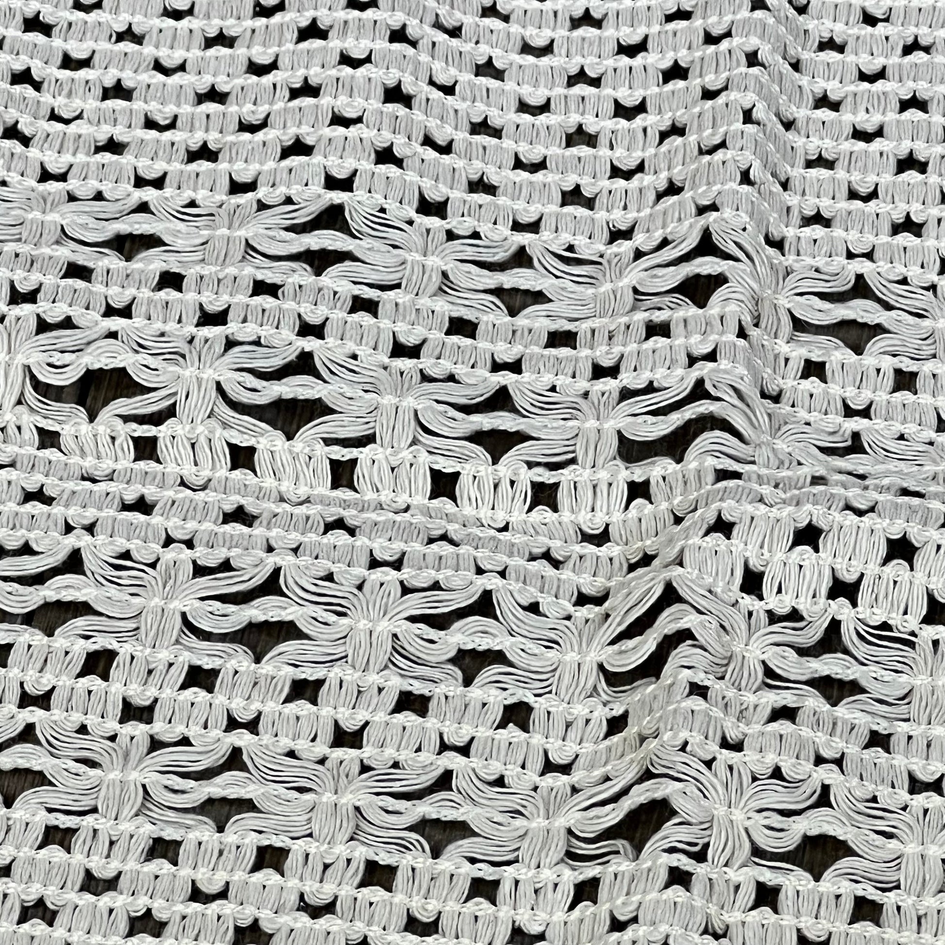 Cream beige macrame table mat showcasing intricate weave, ideal for farmhouse dining decor. Heatproof, cotton linen placemat.