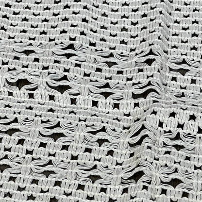 Cream beige macrame table mat showcasing intricate weave, ideal for farmhouse dining decor. Heatproof, cotton linen placemat.