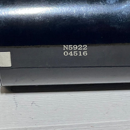 Close-up of a starter replacement part for Kawasaki engines, featuring serial number N5922 04516 on a metallic surface.
