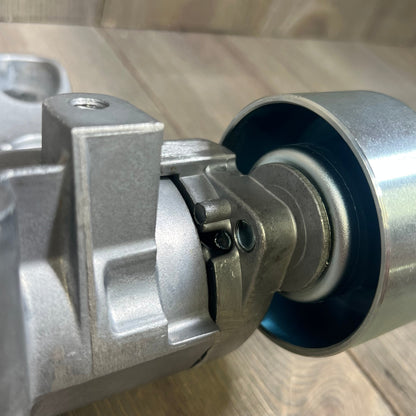 Drive belt tensioner assembly for Toyota Lexus 3.5L 4.0L V6, showcasing durable metal design with pulley detail.