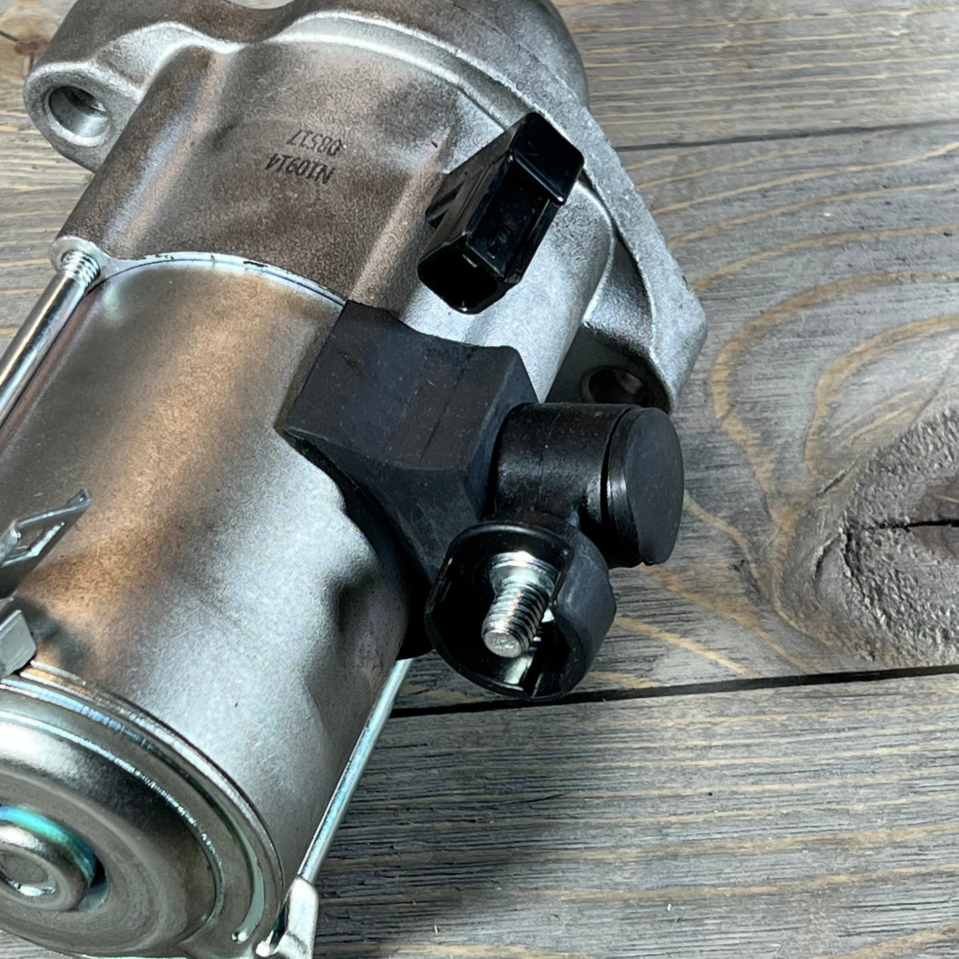 Close-up of a starter motor compatible with Honda Accord 2013-2017, featuring durable metal construction.