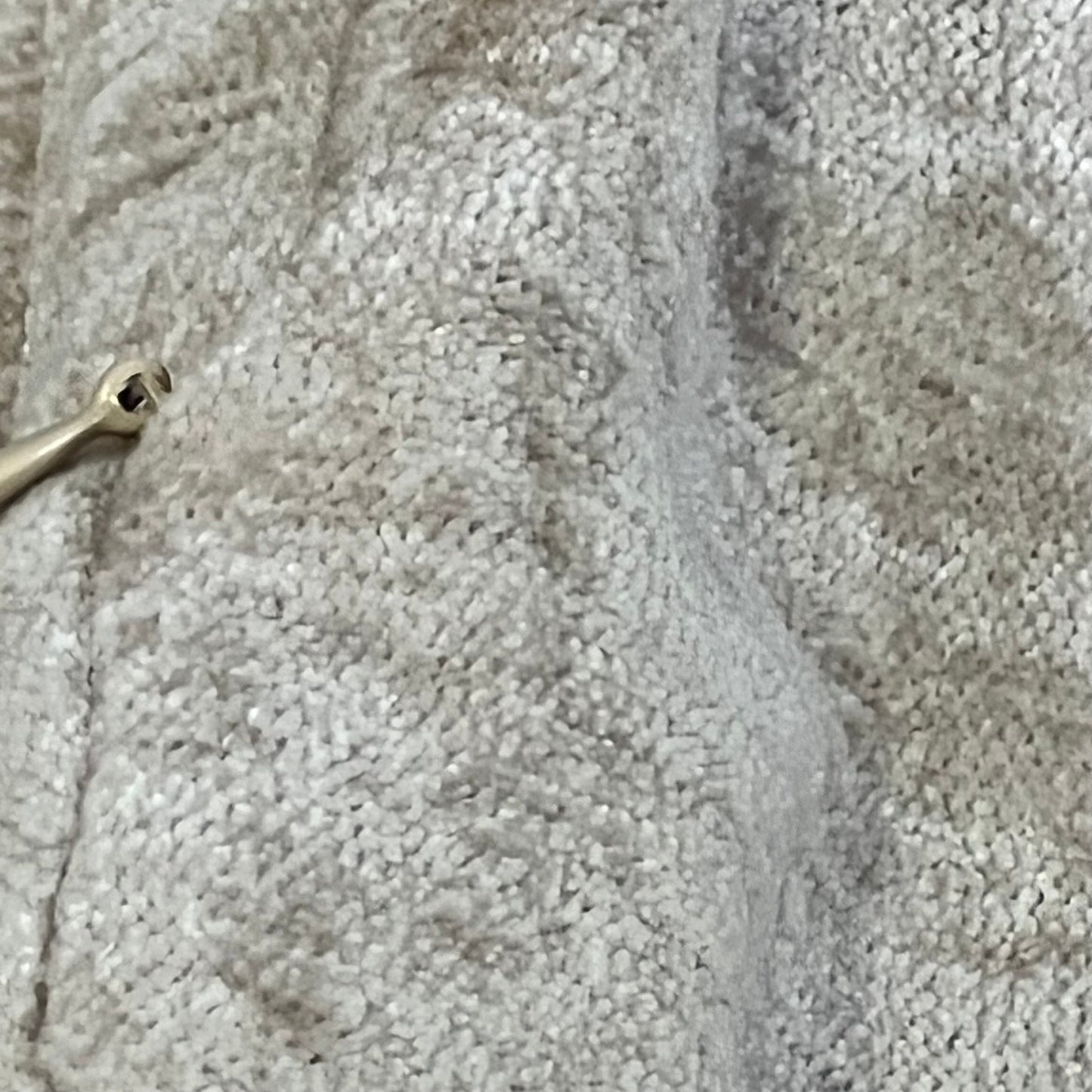 Soft chenille texture of decorUhome pillow cover in bleached sand, showcasing elegant design and quality fabric.