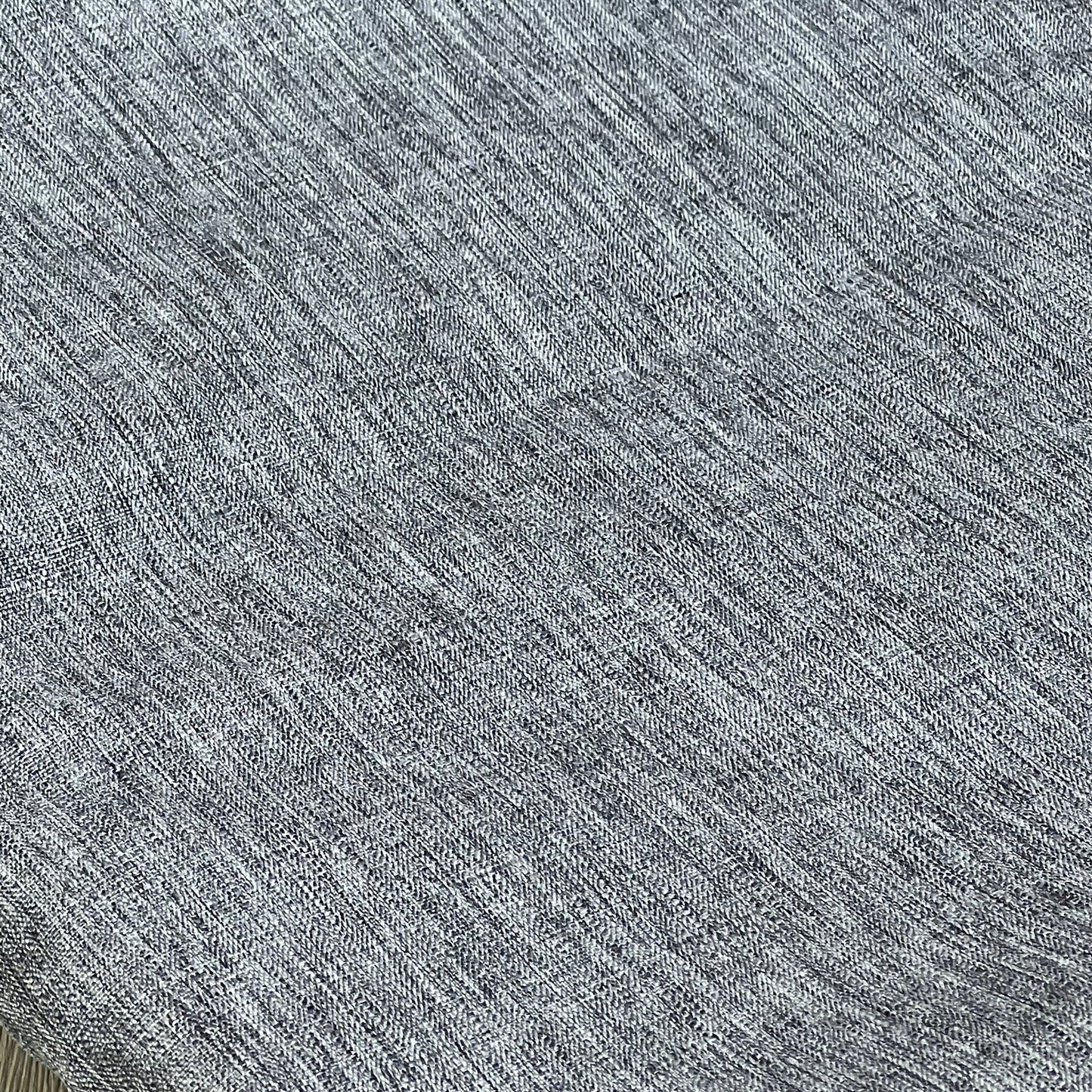 Grey textured linen tablecloth close-up, showcasing waterproof and wrinkle-free fabric for kitchen and event decor.