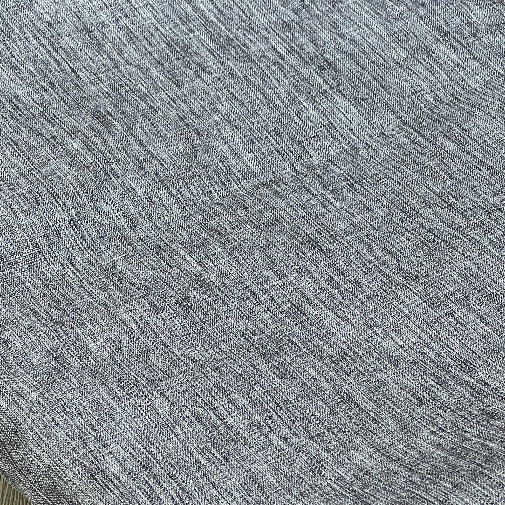 Grey textured linen tablecloth close-up, showcasing waterproof and wrinkle-free fabric for kitchen and event decor.