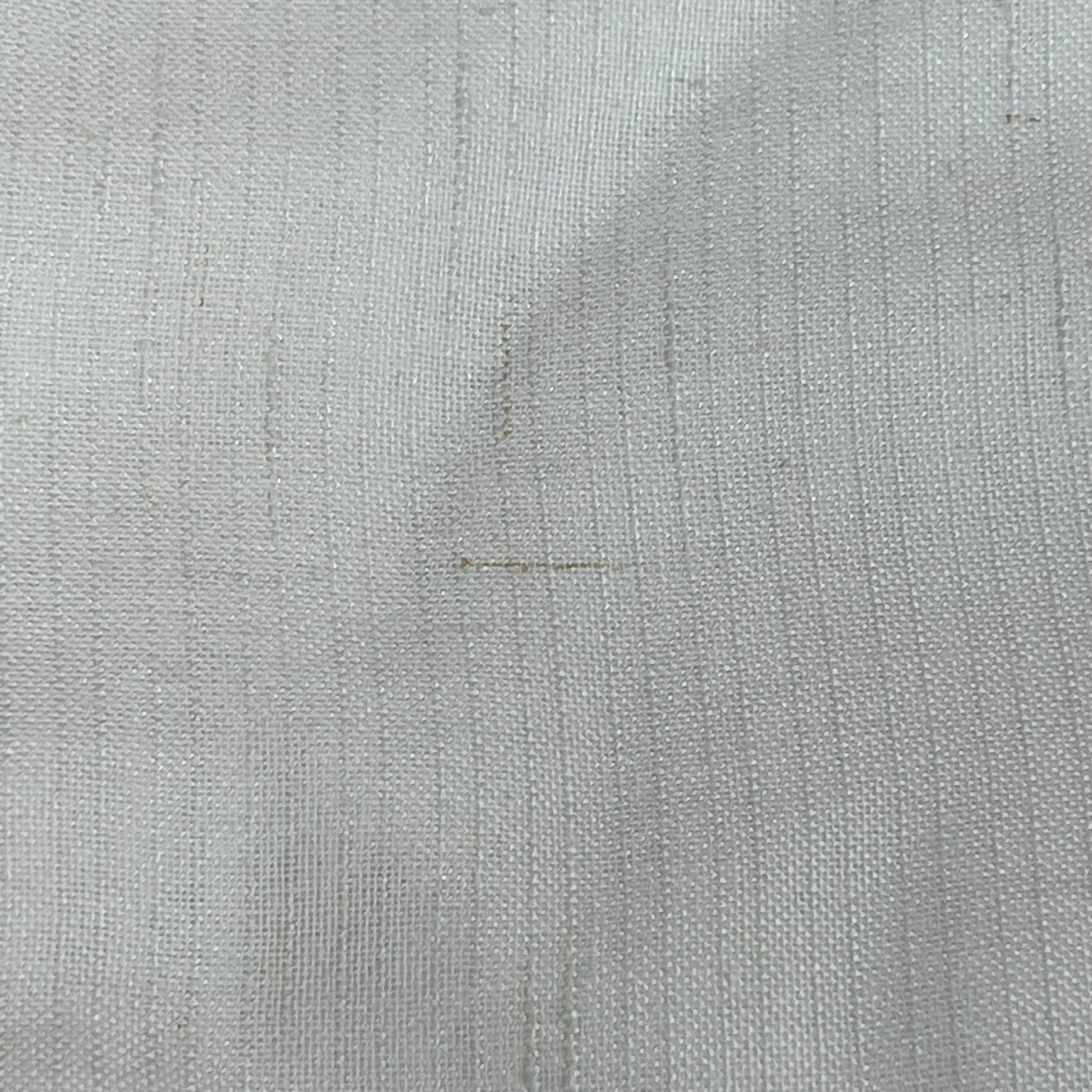 Close-up of Jinchan off-white linen blend fabric, showcasing the textured weave and light filtering quality of the curtains.